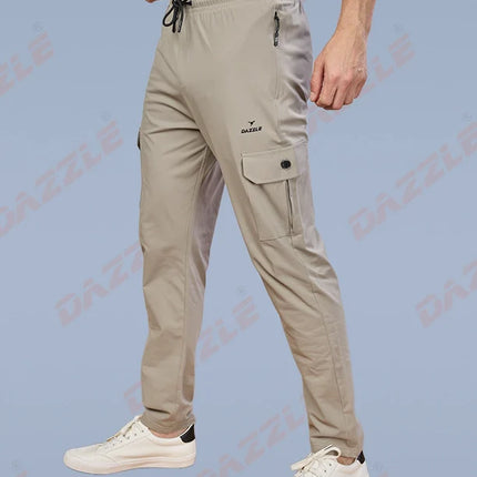Beige cargo pants worn by a person on a light blue background with 'Gazley' branding.