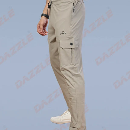 Person wearing beige cargo pants with a white background