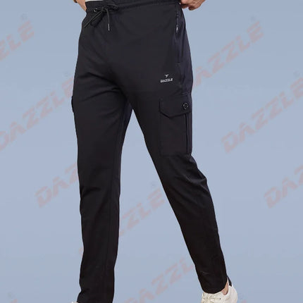 Person wearing black pants with a visible brand logo on a light blue background