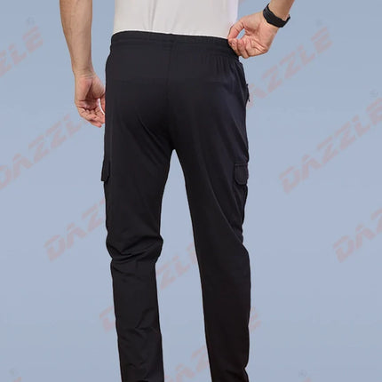 Person wearing black cargo pants on a light blue background with 'Gazzle' branding.