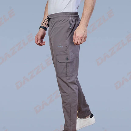 Person wearing gray cargo pants on a light blue background with 'Gazzle' branding.