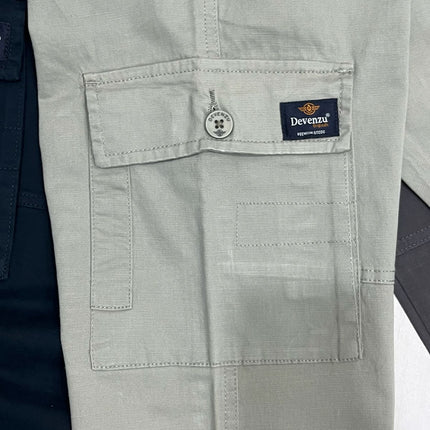 Light gray pants with a visible brand logo on the pocket